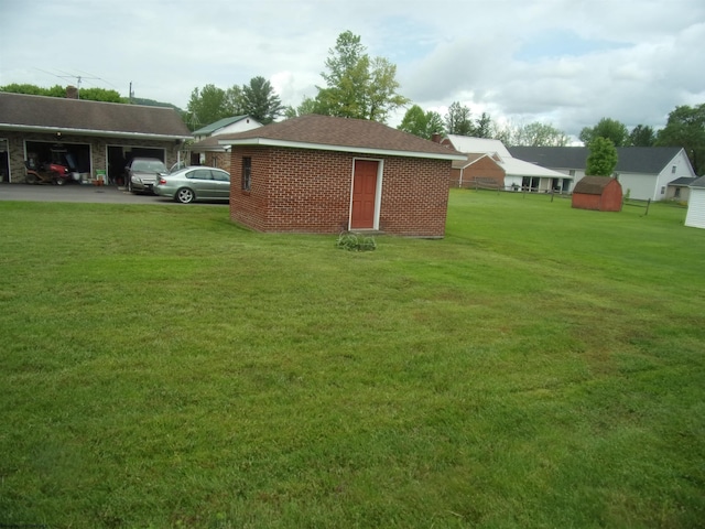 201 Findley St, Elkins, WV 26241 - view of green lawn with an outbuilding and a garage