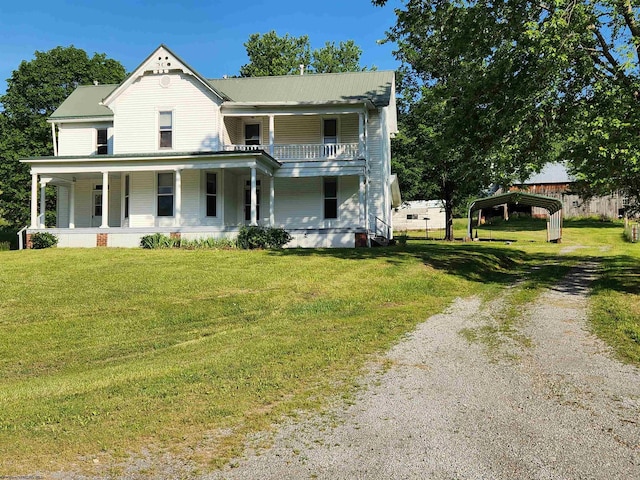 580 Deer Haven Dr, Lost Creek, WV 26385 - view of front facade with driveway, a carport, covered porch, and a front lawn