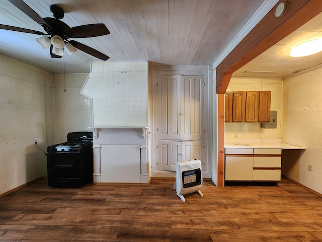 580 Deer Haven Dr, Lost Creek, WV 26385 - kitchen featuring black gas stove, light countertops, heating unit, dark wood finished floors, and tasteful backsplash
