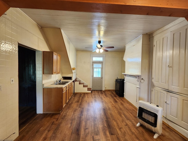 580 Deer Haven Dr, Lost Creek, WV 26385 - kitchen featuring heating unit, brown cabinets, light countertops, dark wood-style flooring, and ornamental molding
