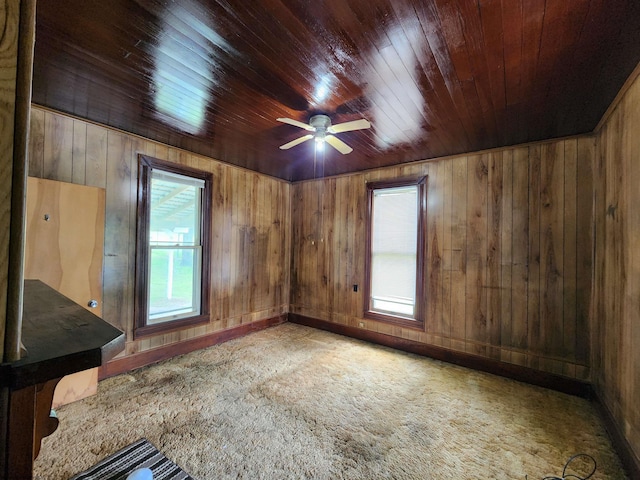 580 Deer Haven Dr, Lost Creek, WV 26385 - empty room with healthy amount of natural light, wooden ceiling, carpet floors, wooden walls, and a ceiling fan