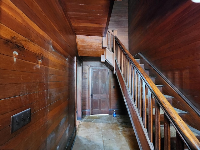 580 Deer Haven Dr, Lost Creek, WV 26385 - stairs featuring wood walls, wooden ceiling, and unfinished concrete floors