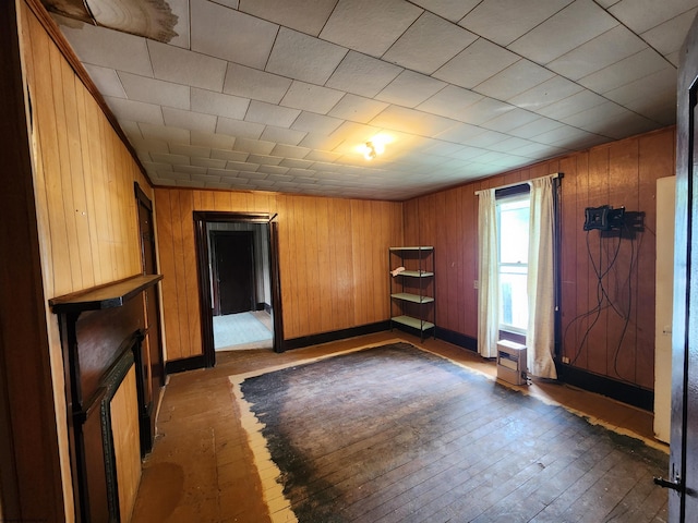 580 Deer Haven Dr, Lost Creek, WV 26385 - spare room featuring hardwood / wood-style floors, wooden walls, and baseboards
