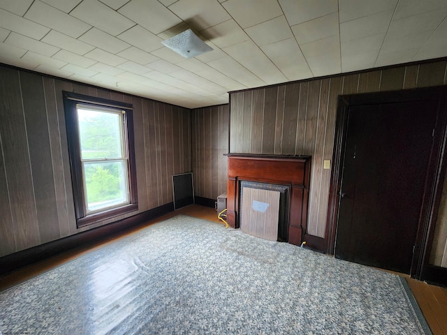 580 Deer Haven Dr, Lost Creek, WV 26385 - unfurnished living room featuring a fireplace and wood walls