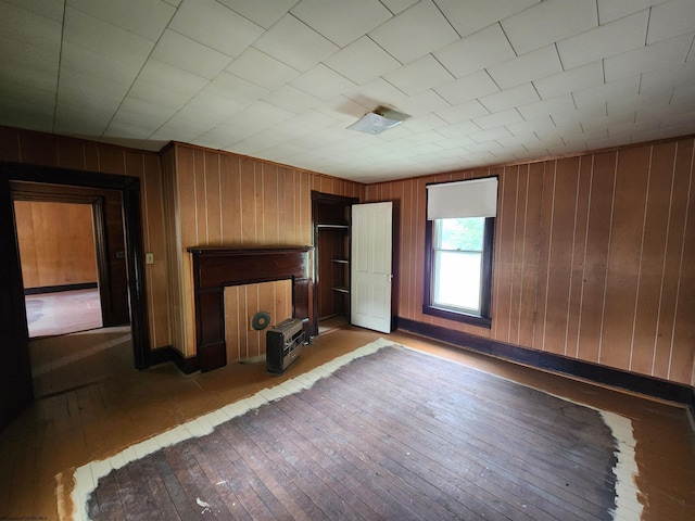 580 Deer Haven Dr, Lost Creek, WV 26385 - unfurnished living room featuring hardwood / wood-style floors and wood walls