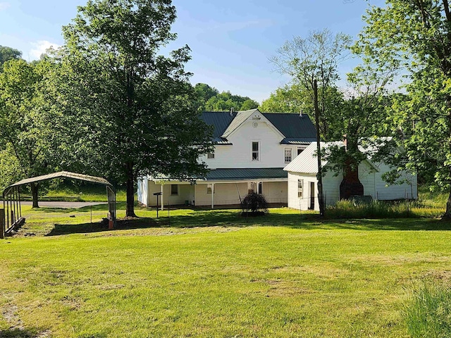 580 Deer Haven Dr, Lost Creek, WV 26385 - view of property exterior with a carport, a lawn, and metal roof