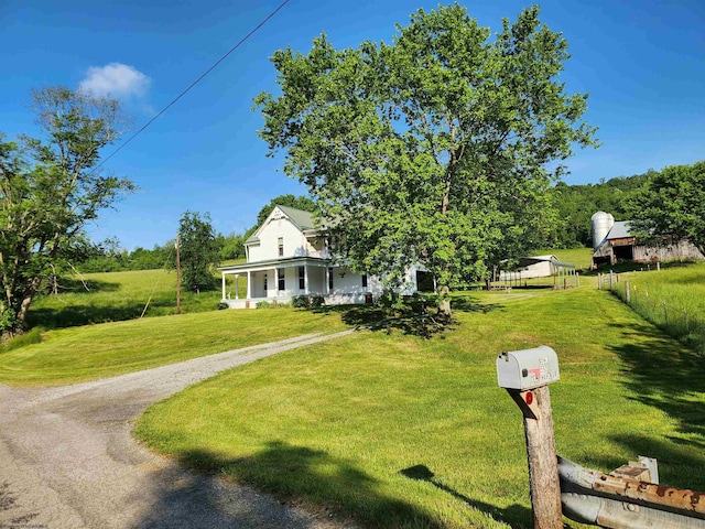 580 Deer Haven Dr, Lost Creek, WV 26385 - farmhouse inspired home with covered porch and dirt driveway