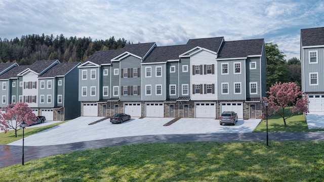 111 Frisco Ln, Bridgeport, WV 26330 - townhome / multi-family property with a front yard, stone siding, driveway, an attached garage, and a residential view