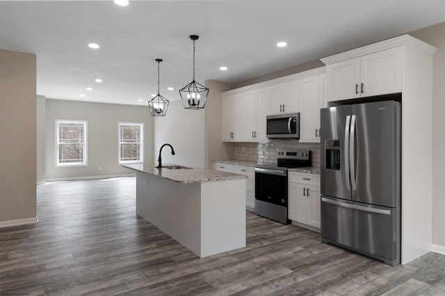 111 Frisco Ln, Bridgeport, WV 26330 - kitchen featuring appliances with stainless steel finishes, a sink, an island with sink, white cabinetry, and dark wood-type flooring