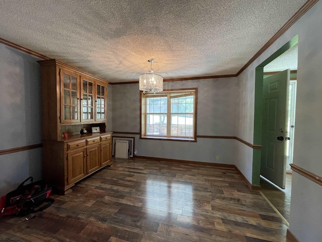 564 Big Run Rd, Napier, WV 26631 - unfurnished dining area with ornamental molding, dark wood-type flooring, a chandelier, a textured ceiling, and baseboards