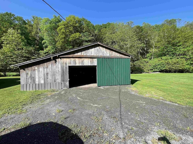 564 Big Run Rd, Napier, WV 26631 - view of outdoor structure featuring an outbuilding, a wooded view, and asphalt driveway