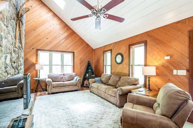 434 Cabin Mountain Rd, Davis, WV 26260 - living room featuring vaulted ceiling, a ceiling fan, wood finished floors, and wooden walls