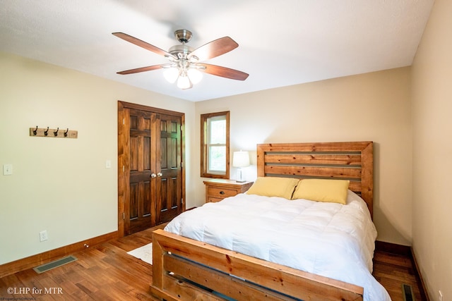 434 Cabin Mountain Rd, Davis, WV 26260 - bedroom featuring baseboards, wood finished floors, a closet, and a ceiling fan