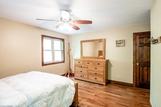 434 Cabin Mountain Rd, Davis, WV 26260 - bedroom featuring light wood-style floors, a ceiling fan, and baseboards