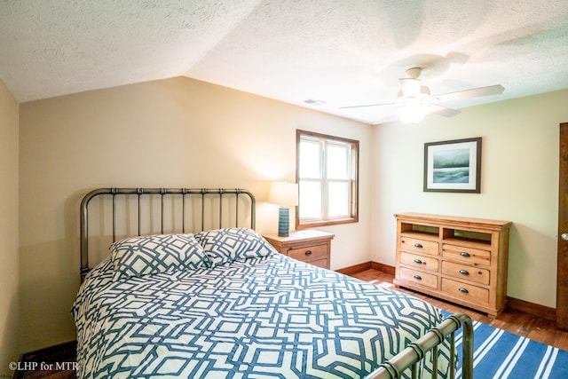 434 Cabin Mountain Rd, Davis, WV 26260 - bedroom featuring wood finished floors, a textured ceiling, baseboards, a ceiling fan, and vaulted ceiling