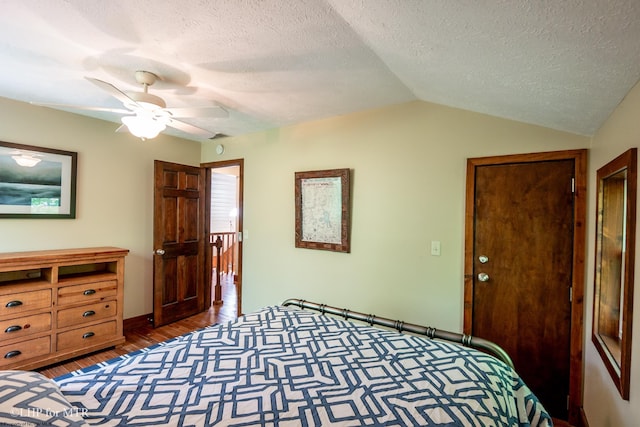 434 Cabin Mountain Rd, Davis, WV 26260 - bedroom featuring lofted ceiling, a textured ceiling, wood finished floors, baseboards, and a ceiling fan