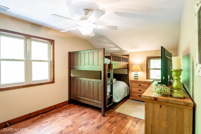 434 Cabin Mountain Rd, Davis, WV 26260 - bedroom featuring light wood finished floors, vaulted ceiling, baseboards, and a ceiling fan