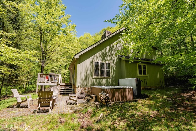 434 Cabin Mountain Rd, Davis, WV 26260 - back of property with a hot tub, a patio, a wooden deck, and stairs