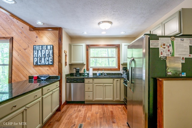 434 Cabin Mountain Rd, Davis, WV 26260 - kitchen featuring appliances with stainless steel finishes, a sink, healthy amount of natural light, dark countertops, and a textured ceiling