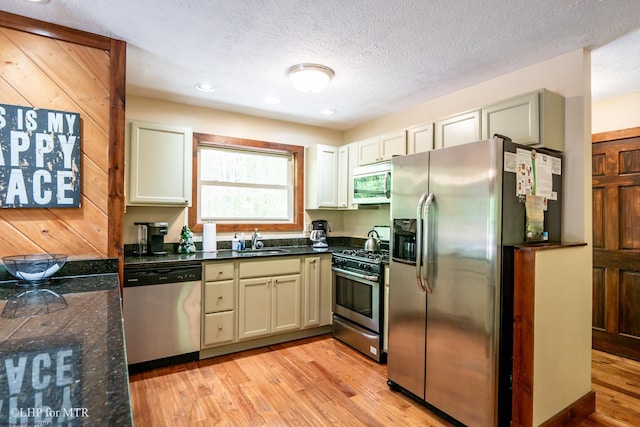 434 Cabin Mountain Rd, Davis, WV 26260 - kitchen with stainless steel appliances, a sink, light wood-style floors, a textured ceiling, and recessed lighting
