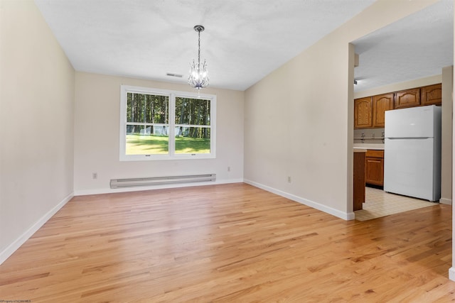 42 Ice Linn Ln, Fairmont, WV 26554 - unfurnished dining area with baseboard heating, light wood finished floors, a chandelier, and baseboards