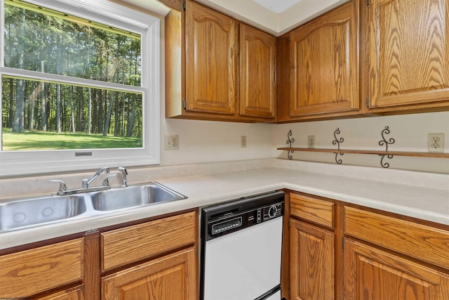 42 Ice Linn Ln, Fairmont, WV 26554 - kitchen with white dishwasher, a sink, light countertops, and brown cabinetry