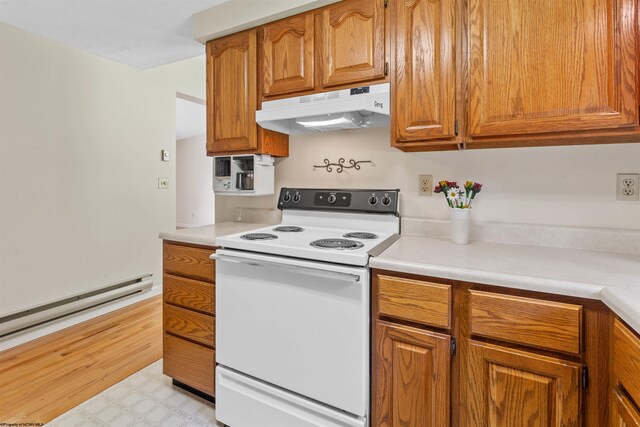 42 Ice Linn Ln, Fairmont, WV 26554 - kitchen featuring white range with electric cooktop, under cabinet range hood, brown cabinets, and light countertops
