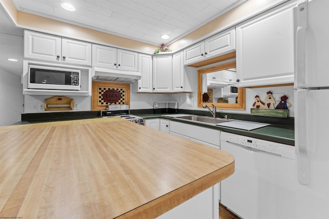 42 Ice Linn Ln, Fairmont, WV 26554 - kitchen with under cabinet range hood, a sink, white appliances, white cabinets, and dark countertops