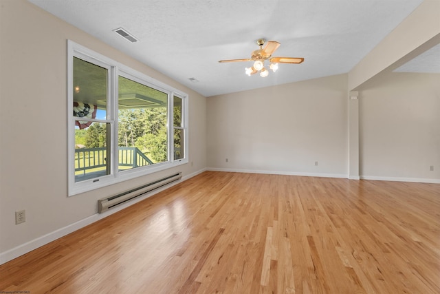 42 Ice Linn Ln, Fairmont, WV 26554 - empty room with baseboard heating, light wood-style flooring, baseboards, and a ceiling fan