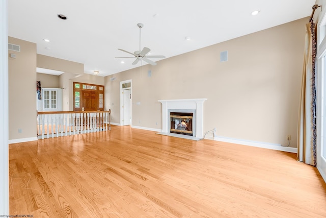 2022 Georgian Ln, Morgantown, WV 26508 - unfurnished living room with a ceiling fan, light wood-type flooring, a fireplace with flush hearth, recessed lighting, and baseboards