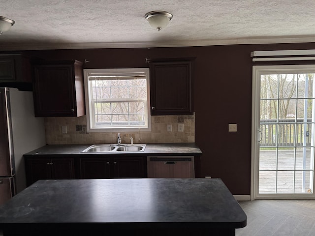 31 Sanctuary Ln, Worthington, WV 26591 - kitchen featuring a sink, dishwasher, a textured ceiling, healthy amount of natural light, and decorative backsplash