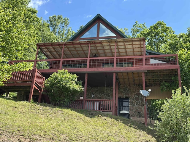 717 Lakeview Dr, Horner, WV 26372 - back of house with stone siding, a lawn, and a deck