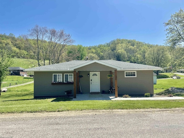 1829 Crooked Run Rd, Clarksburg, WV 26301 - view of front facade featuring a front lawn, a forest view, and a shingled roof