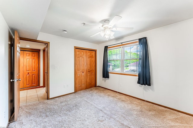 233 Creekside Dr Unit 3, Morgantown, WV 26508 - unfurnished bedroom featuring light colored carpet, baseboards, a closet, and a ceiling fan