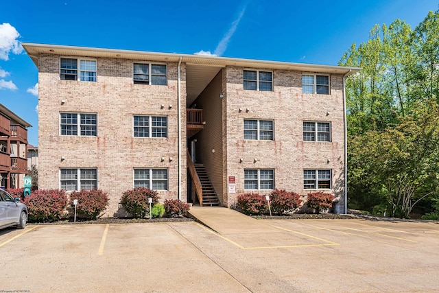 233 Creekside Dr Unit 3, Morgantown, WV 26508 - view of building exterior featuring uncovered parking and stairs