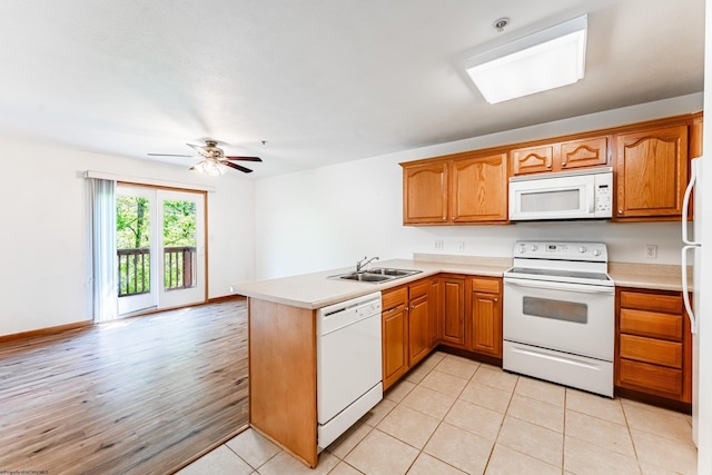 233 Creekside Dr Unit 3, Morgantown, WV 26508 - kitchen featuring white appliances, a peninsula, a sink, and light countertops