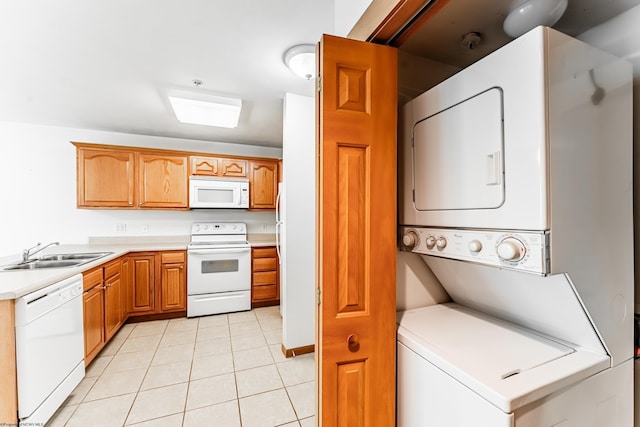 233 Creekside Dr Unit 3, Morgantown, WV 26508 - kitchen with white appliances, a sink, stacked washer / dryer, light tile patterned floors, and light countertops
