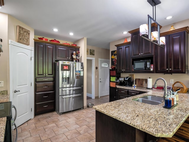 40 Briarwood Dr, Elkins, WV 26241 - kitchen with stainless steel fridge with ice dispenser, black microwave, a sink, a peninsula, and light stone countertops