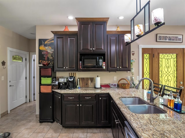 40 Briarwood Dr, Elkins, WV 26241 - kitchen featuring a sink, black microwave, light stone countertops, dark brown cabinetry, and light tile patterned floors