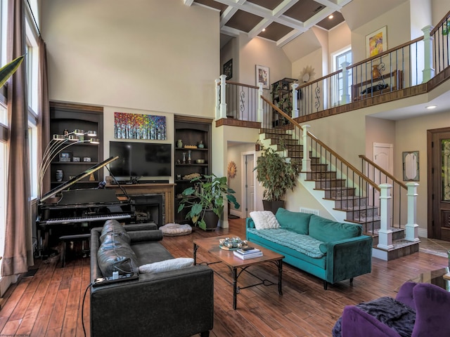 40 Briarwood Dr, Elkins, WV 26241 - living area featuring a towering ceiling, stairway, coffered ceiling, beam ceiling, and hardwood / wood-style floors