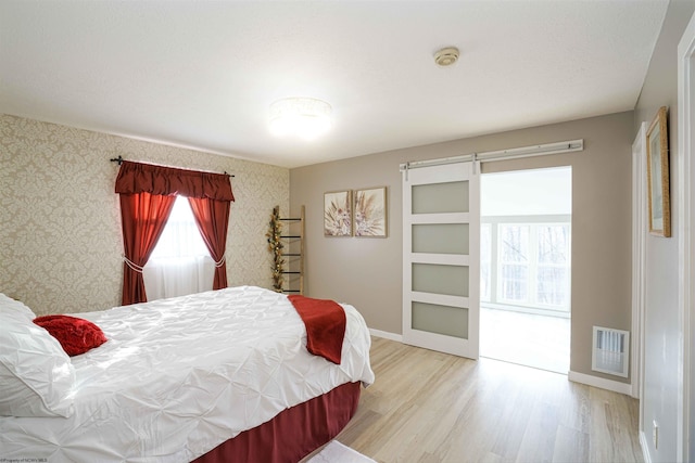 213 Forest Dr, Bridgeport, WV 26330 - bedroom with wood finished floors, baseboards, and wallpapered walls