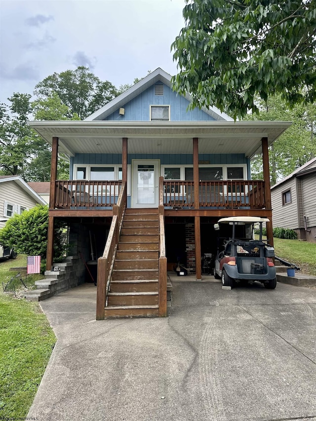 1322 Crystal Lake Rd, West Union, WV 26456 - view of front of property featuring board and batten siding, a porch, and stairway