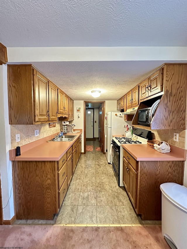 1322 Crystal Lake Rd, West Union, WV 26456 - kitchen featuring black appliances, a sink, light countertops, brown cabinetry, and a textured ceiling
