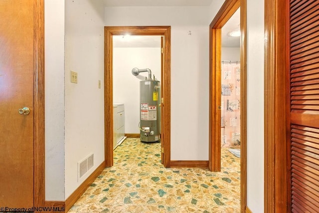 737 Summit Park Ave, Clarksburg, WV 26301 - hallway featuring gas water heater, washer / dryer, and baseboards