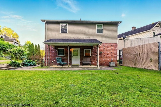 737 Summit Park Ave, Clarksburg, WV 26301 - rear view of property featuring brick siding, a lawn, central AC unit, and a patio