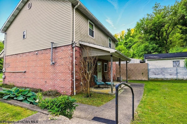 737 Summit Park Ave, Clarksburg, WV 26301 - view of side of property featuring brick siding and a patio area