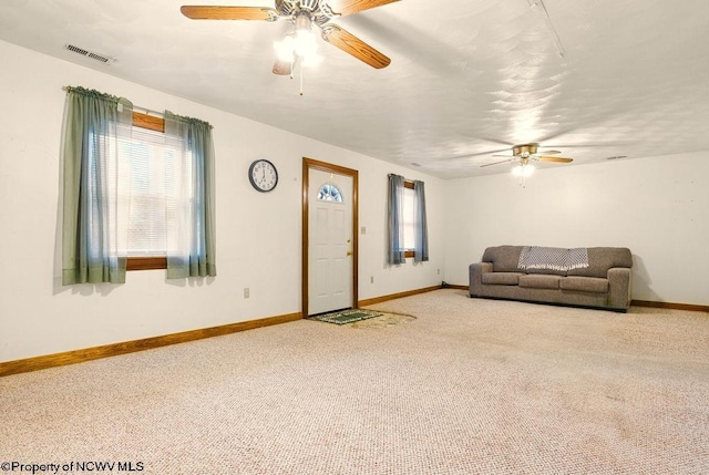 737 Summit Park Ave, Clarksburg, WV 26301 - carpeted living room featuring a ceiling fan, healthy amount of natural light, and baseboards