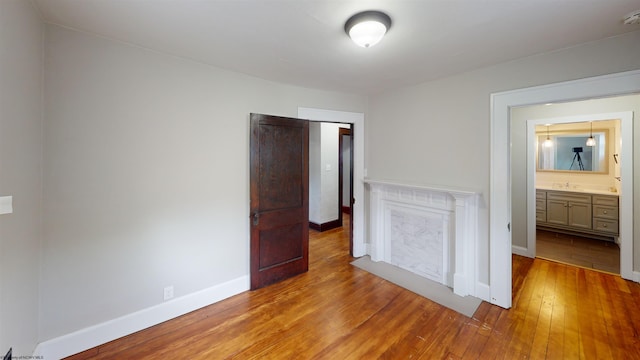 505 State St, Fairmont, WV 26554 - unfurnished bedroom with hardwood / wood-style floors, baseboards, and a sink