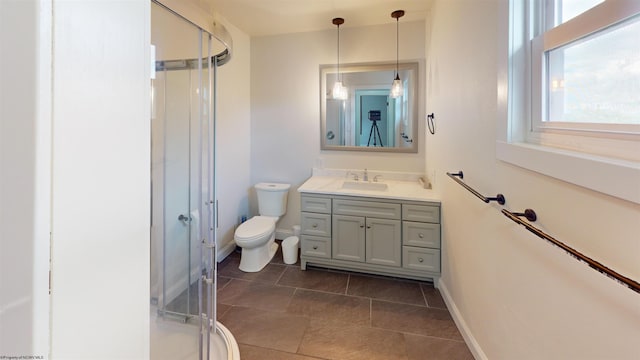 505 State St, Fairmont, WV 26554 - bathroom with toilet, vanity, a shower stall, baseboards, and tile patterned flooring
