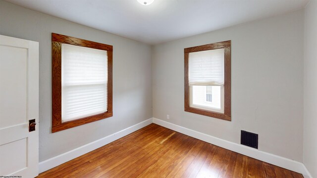 505 State St, Fairmont, WV 26554 - empty room featuring baseboards, wood-type flooring, and healthy amount of natural light